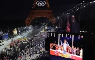 Delegações chegam ao Trocadero enquanto espectadores assistem a apresentação do cantor francês Philippe Katerine em uma tela gigante durante a cerimônia de abertura das Olimpíadas Paris 2024 em  26 de julho de 2024.