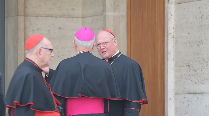 Cardinal_Timothy_Dolan_R_speaks_with_Archbishop_Jospeh_Kurtz_C_outside_the_Vaticans_Synod_Hall_on_Oct_13_2014_Credit_Bohumil_Petrik_CNA_CNA_10_13_14.jpg ?? 