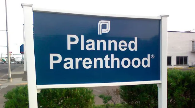 CartelPlannedParenthood_FlickrShaineMataCC-BY-NC-2.0_070119.jpg ?? 